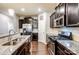Open kitchen with island, granite counters, and stainless steel appliances at 3033 Honeylocust Ln, Fort Mill, SC 29707