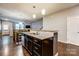 Open kitchen with island, granite counters, and stainless steel appliances at 3033 Honeylocust Ln, Fort Mill, SC 29707
