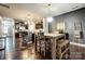Modern kitchen features dark cabinetry, stainless steel appliances, and an island at 3033 Honeylocust Ln, Fort Mill, SC 29707