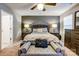 Main bedroom with plush bed, dark wood furniture, and ceiling fan at 3033 Honeylocust Ln, Fort Mill, SC 29707