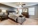 Spacious main bedroom with a comfortable bed and ample natural light at 3033 Honeylocust Ln, Fort Mill, SC 29707
