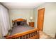 Cozy bedroom with wood framed bed and nightstand at 338 Piney Grove Rd, Harmony, NC 28634