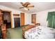 Bedroom with wooden furniture and green carpet at 338 Piney Grove Rd, Harmony, NC 28634