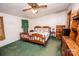Bedroom with wooden furniture and green carpet at 338 Piney Grove Rd, Harmony, NC 28634