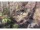 Small creek flows through a wooded area at 338 Piney Grove Rd, Harmony, NC 28634