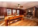 Dining area with wood table and stone fireplace at 338 Piney Grove Rd, Harmony, NC 28634