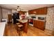 Kitchen features wood cabinets, granite island, and hardwood floors at 338 Piney Grove Rd, Harmony, NC 28634