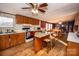 Kitchen boasts wood cabinets, granite island, and hardwood floors at 338 Piney Grove Rd, Harmony, NC 28634