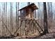 Rustic treehouse with ladder access in the woods at 338 Piney Grove Rd, Harmony, NC 28634