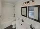 Clean bathroom with a double vanity, bathtub, and updated fixtures at 4210 Manchester Ln, Monroe, NC 28110