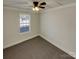 Spacious bedroom with neutral walls and carpet, featuring a large window at 4210 Manchester Ln, Monroe, NC 28110