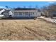 Charming light blue house with a front porch and well-maintained lawn at 4210 Manchester Ln, Monroe, NC 28110