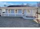 Charming light blue house with a front porch and well-maintained lawn at 4210 Manchester Ln, Monroe, NC 28110