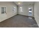 Bright living room with neutral carpeting and access to the backyard at 4210 Manchester Ln, Monroe, NC 28110
