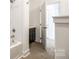 Bathroom with a bathtub and shower combo and grey vanity at 502 Rhyne Cir, Gastonia, NC 28054