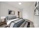 Cozy bedroom featuring hardwood floors, neutral paint, and modern decor, creating a relaxing and inviting atmosphere at 502 Rhyne Cir, Gastonia, NC 28054