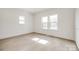 Inviting bedroom filled with natural light from multiple windows and light-colored wood flooring at 502 Rhyne Cir, Gastonia, NC 28054