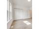 This bright bedroom features natural light from large windows, recessed lighting, and double closets at 502 Rhyne Cir, Gastonia, NC 28054