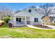 Charming single-Gathering home showcasing a white exterior with stone accents and well-manicured landscaping at 502 Rhyne Cir, Gastonia, NC 28054