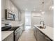 Modern kitchen featuring stainless steel appliances, quartz countertops, and sleek cabinetry for a contemporary cooking space at 502 Rhyne Cir, Gastonia, NC 28054