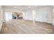 Bright, open-concept living space with wood floors flowing into a modern kitchen featuring stainless steel appliances at 502 Rhyne Cir, Gastonia, NC 28054