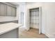 Kitchen area showcasing open pantry space with wire shelving and a view of the cabinets at 502 Rhyne Cir, Gastonia, NC 28054