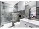 Bathroom with gray marble tile and walk-in shower at 516 Spring Garden Ave, Kannapolis, NC 28081