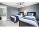 Two twin beds in a room with gray walls and ceiling fan at 516 Spring Garden Ave, Kannapolis, NC 28081