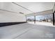 Open carport providing covered parking with backyard view at 516 Spring Garden Ave, Kannapolis, NC 28081