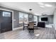 Open concept dining area with glass table and modern lighting at 516 Spring Garden Ave, Kannapolis, NC 28081