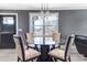 Modern dining room with glass-top table and four chairs at 516 Spring Garden Ave, Kannapolis, NC 28081
