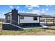 Modern home exterior with white siding, black accents, and a covered patio at 516 Spring Garden Ave, Kannapolis, NC 28081