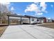 Newly renovated home with carport and landscaping at 516 Spring Garden Ave, Kannapolis, NC 28081