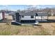 Modern home with dark gray accents and landscaping at 516 Spring Garden Ave, Kannapolis, NC 28081