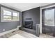 Modern fireplace with dark brick surround and door at 516 Spring Garden Ave, Kannapolis, NC 28081