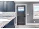 Modern kitchen with dark cabinets and white counters at 516 Spring Garden Ave, Kannapolis, NC 28081