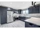Modern kitchen with stainless steel appliances and white quartz countertops at 516 Spring Garden Ave, Kannapolis, NC 28081