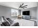 Living room with TV, seating, and ceiling fan at 516 Spring Garden Ave, Kannapolis, NC 28081