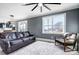 Bright living room featuring leather furniture and large windows at 516 Spring Garden Ave, Kannapolis, NC 28081