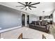 Spacious living room with leather sofa and modern ceiling fan at 516 Spring Garden Ave, Kannapolis, NC 28081