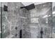 Modern shower with marble tile and rainfall shower head at 516 Spring Garden Ave, Kannapolis, NC 28081