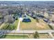 Sprawling property with a brick home, lush yard, detached garage, and swimming pool at 7169 Pleasant Grove Rd, Charlotte, NC 28216