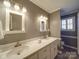 Double vanity bathroom with updated fixtures and gray walls at 7169 Pleasant Grove Rd, Charlotte, NC 28216