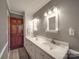 Double vanity bathroom with updated fixtures and gray walls at 7169 Pleasant Grove Rd, Charlotte, NC 28216