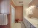 Clean bathroom with double vanity and shower at 7169 Pleasant Grove Rd, Charlotte, NC 28216