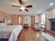 Spacious primary bedroom with hardwood floors and fireplace at 7169 Pleasant Grove Rd, Charlotte, NC 28216