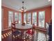 Charming dining room with round table and pool view at 7169 Pleasant Grove Rd, Charlotte, NC 28216