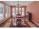 Bright dining room with round table and pool view at 7169 Pleasant Grove Rd, Charlotte, NC 28216