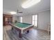 Game room featuring a pool table and hardwood floors at 7169 Pleasant Grove Rd, Charlotte, NC 28216