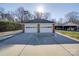 Two-car detached brick garage with new doors at 7169 Pleasant Grove Rd, Charlotte, NC 28216
